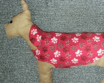 Reversible fleece and cotton dog coat, sweater. Small (15-19 lbs). 19.5" girth. Paw prints on red and colorful dogs. Poodle, Beagle, Bichon