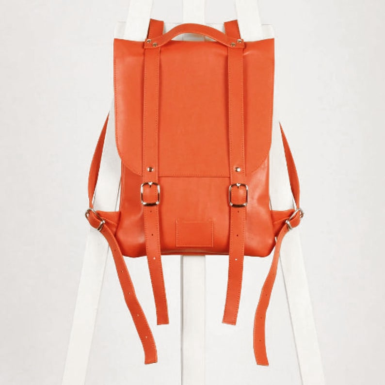 black friday leather backpack Men's Perfecto in Matte a zippered back sleeve to affix the bag to carry Pumpkin Red Leather Backpack Rucksack
