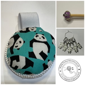 May include: A teal blue fabric pincushion with a white elastic loop for hanging. The pincushion is covered in a black and white panda print. The pincushion is surrounded by a white cord. The image also includes a close-up of a panda-shaped stitch marker and a wooden knitting needle with a panda bead.