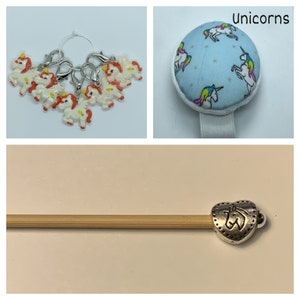 May include: A set of unicorn themed knitting stitch markers, a pin cushion with a unicorn print, and a knitting needle with a unicorn charm.