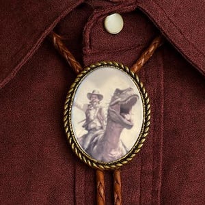 Cowboy Riding Dinosaur Bolo Tie : Funny Leather Necktie