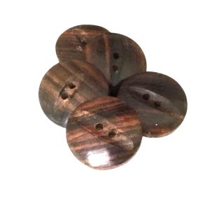 May include: A collection of five round buttons with two holes each. The buttons are a dark brown color with reddish-brown and black wood grain patterns. The buttons are arranged in a slightly overlapping cluster.