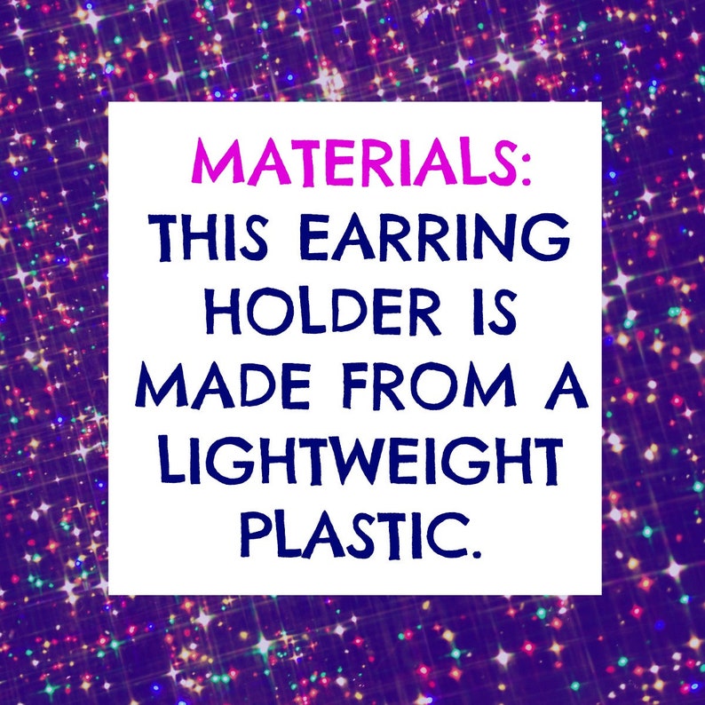 May include: A white square with the text "MATERIALS: THIS EARRING HOLDER IS MADE FROM A LIGHTWEIGHT PLASTIC." in pink and blue text on a purple background with a sparkling effect.