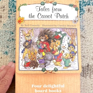 May include: A set of children's board books titled "Tales from the Carrot Patch" in a carrying case. The cover shows illustrations of animal characters. The text reads "Four delightful board books in a handy carrying case."