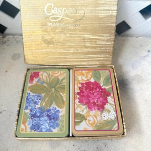 Vintage Casper speelkaartenspellen met bloemen in gouden doos / dubbele kaartspellen met jumbo-gezichten van Casper So Pretty