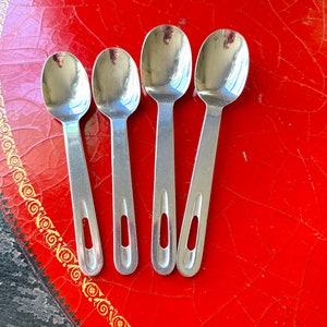 Four Cambridge Stainless China Spoons with Hole in Handle