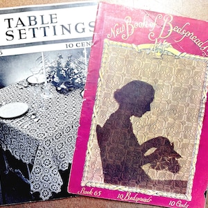May include: Two vintage books: "New Table Settings" and "New Book of Bedspreads." The "Table Settings" book features a black and white image of a table setting. The "Bedspreads" book has a pink cover with a silhouette and gold accents. Both books are marked with a price of 10 cents.