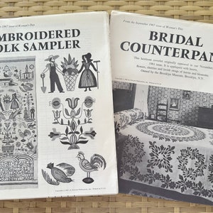 May include: Two magazine pages from Woman's Day magazine. The left page features a black and white illustration of an embroidered folk sampler with a rooster, flowers, and a house. The right page features a black and white photograph of a bridal counterpane with a floral design. The text on the left page reads "Embroidered Folk Sampler" and the text on the right page reads "Bridal Counterpane".