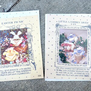 May include: Two vintage Easter-themed craft pattern booklets. One titled "Easter Picnic" features a bunny with a basket of treats. The other, "Little Lambsey Divey," shows lamb figures. Both have decorative borders and text.