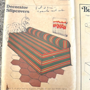May include: Vintage sewing pattern for decorator slipcovers. The illustration shows a sofa with green and red striped fabric, two bolster pillows, and a matching wall art piece. The pattern is from the brand "Butterick".