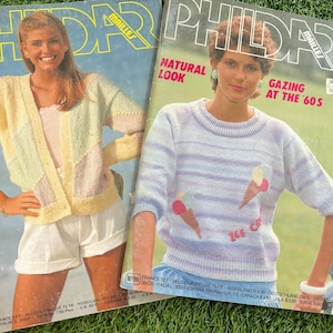 May include: Two vintage Phildar knitting pattern magazines. One cover shows a woman in a pastel cardigan and white shorts. The other cover features a woman in a striped sweater with ice cream cone designs. Text includes "Natural Look" and "Gazing at the '60s."