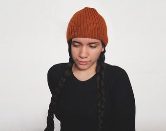 hand knit wool free hat -- the torse beanie in rust