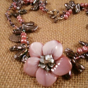 Mother of Pearl, Pearl Necklace -A floral mother of pearl centerpiece, is surrounded by a necklace of stick pearls and Bali silver.