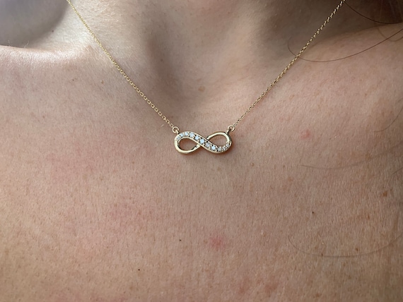 Gold diamond infinity best sale necklace
