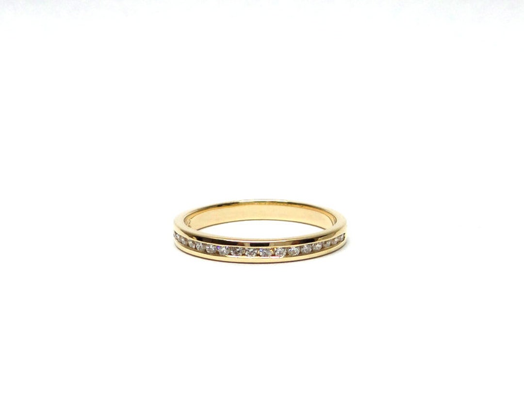 At Auction: A 14ct yellow gold Chanel set Diamond ring.