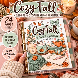 May include: A ring-bound planner titled Cozy Fall Wellness & Organisation Planner featuring illustrations of a mug with whipped cream, a pumpkin, books, a knit blanket, and autumn leaves. The cover includes text and a pink pen on a notepad.