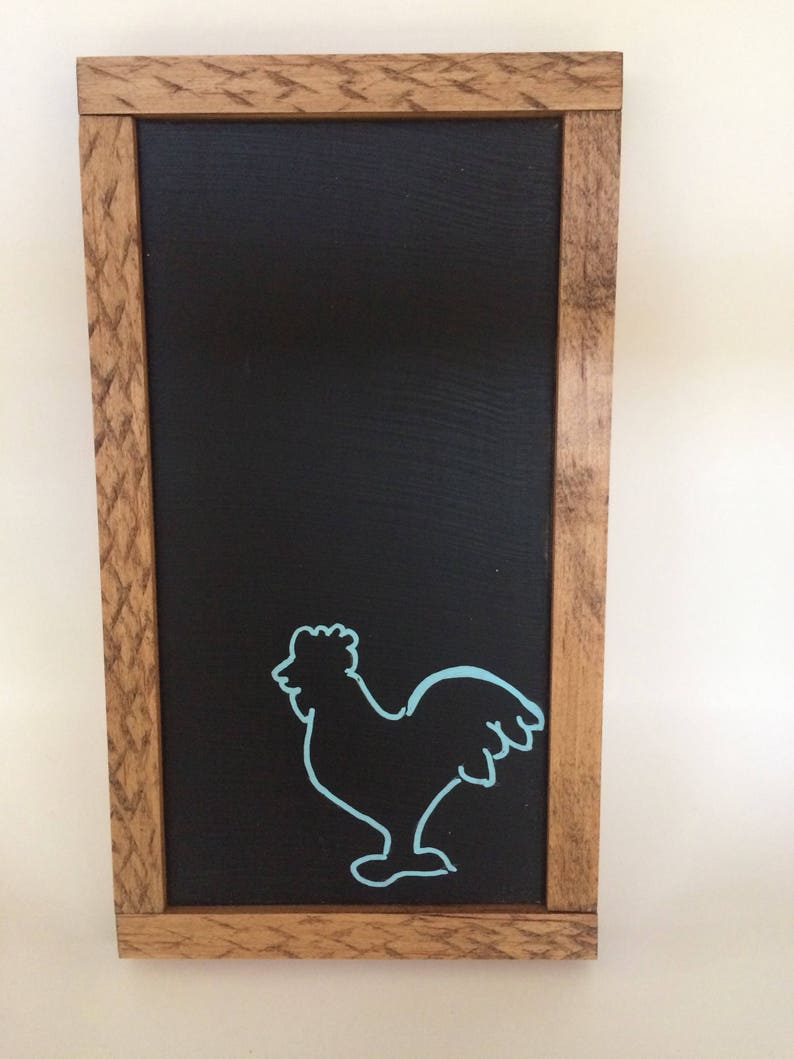 Chalkboard with blue rooster outline