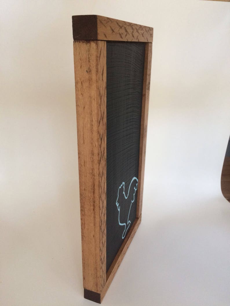 Chalkboard with blue rooster outline