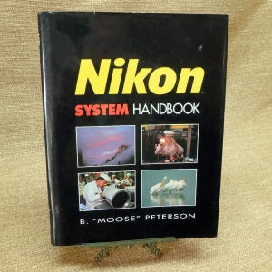 May include: A rustic wooden sign with the text "Welcome to our home" in white lettering. The sign features a distressed finish and a simple, inviting design, perfect for a front porch or entryway.