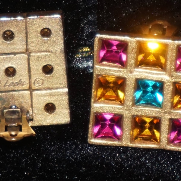 Vintage Patricia Locke designer earrings from the late 70’s.  Gold tone square clip on earrings with multi colored faceted rhinestones.