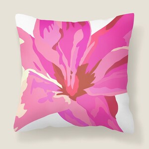 pillow with a pink flower illustration onit