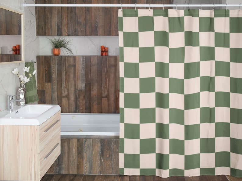 May include: A green and white checkered shower curtain hangs in a bathroom with a wooden wall and a white bathtub.