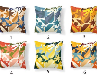 May include: Six different patterned throw pillow covers with abstract floral designs in various colors, including blue, green, yellow, orange, and brown. The pillows are arranged in two rows of three.