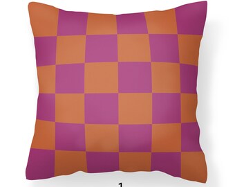 May include: A decorative pillow with a checkered pattern in shades of orange and purple.