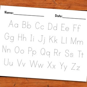 May include: A black and white printable worksheet with dotted lines for tracing the English alphabet in uppercase and lowercase letters. The worksheet has the words "Name:" and "Date:" at the top.