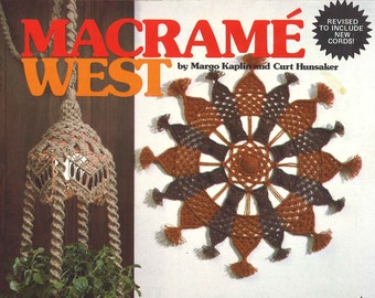 May include: The cover of a vintage macramé book, "Macramé West," features a hanging plant holder and a wall hanging. The book's title is in red and orange, with the text "Unique Designs For Your Home & Garden" below.