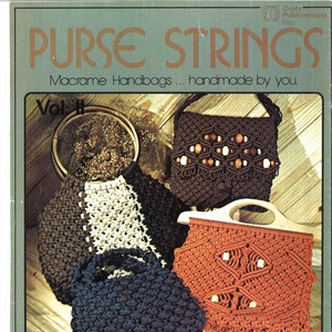 May include: A book cover with the title "PURSE STRINGS" in brown lettering. The subtitle is "Macrame Handbags... handmade by you." The cover features four macrame handbags in different colors and patterns. The book is titled "Vol II" and has a number "7107" on the bottom right corner.