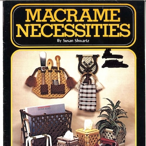 May include: A book titled "Macrame Necessities" by Susan Shwartz, featuring a variety of macrame projects, including a wall hanging with a pocket, a plant hanger, a tissue box cover, a mirror, and a magazine rack. The book cover is black with yellow text and a yellow border.