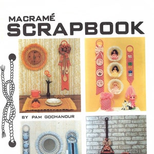 May include: A book titled "Macrame Scrapbook" by Pam Gochanour, featuring four images of macrame projects. The projects include a clock, a wall hanging with three doll-sized frames, a mirror with a hanging towel rack, and a broom with a decorative handle.