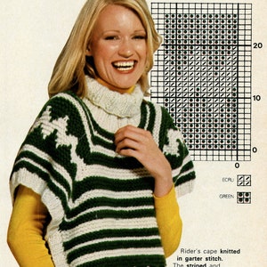 May include: A white and green knitted cape with a striped and jacquard pattern. The cape is knitted in a garter stitch and has a high neck. The text "Rider's cape knitted in garter stitch. The striped and jacquard patterns are edged in 3/2 ribbing - Misses: 12 - Heavy Weight Yarn." is printed below the image.