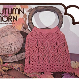 May include: A pink macrame bag with a wooden handle and beads. The bag is called "Autumn Morn" and has instructions on page 14.