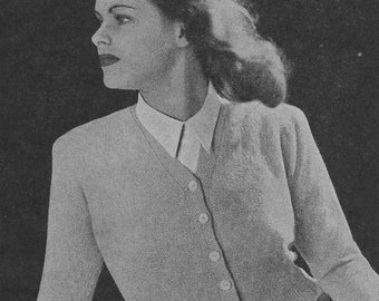 May include: A black and white photo of a woman wearing a light-colored cardigan with buttons down the front. She is sitting on a textured surface with a white label that reads "Patons & Baldwins" in the bottom left corner.