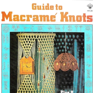 May include: A book titled "Guide to Macrame Knots" with a picture of a macrame wall hanging with a clock and a macrame lampshade. The book includes instructions for 8 exciting projects.