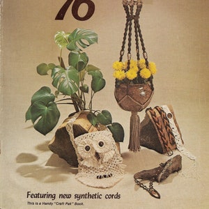 May include: A vintage book cover for macrame featuring the title "Macrame '76" in brown lettering. The cover also features a macrame plant hanger with a brown and beige cord, a potted plant with yellow flowers, and a crocheted owl bag.