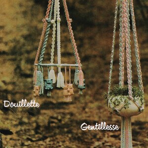 May include: Two macrame plant hangers, one with a white pot and the other with a blue and pink pot. The hangers are made with pink, white, and green yarn. The text "Douillette" and "Gentillesse" are written below the hangers.