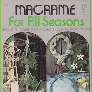 May include: A book cover with the title "Macrame For All Seasons" and a subtitle "Beautiful Variety of Projects - Easy to Advanced". The cover features four macrame projects: a plant hanger, a wreath, a necklace, and a bag. The book is by Tracy Williamson, Liz Barfield, and Gwen Baird. It includes 47 projects in all.