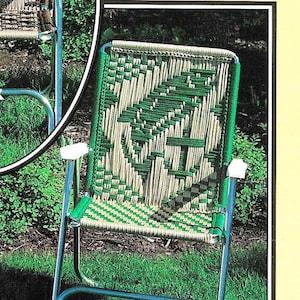 May include: A green and white woven chair with a metal frame. The chair is sitting on a grassy lawn. The text "Fish & Anchor page 14" is visible in the bottom right corner of the image.