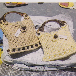 May include: Two crocheted handbags with wooden handles. The bag on the left is beige and the bag on the right is yellow.