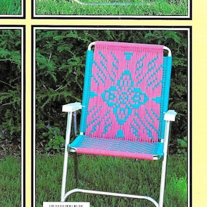 May include: A pink and blue woven chair with a geometric design. The chair is made of metal and has a folding frame. The chair is sitting on a green lawn. The text "Design page 16" is printed below the chair.