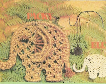 May include: Two macrame elephant wall hangings. One is brown and the other is white. The brown elephant has the text "PACKY" above it and the white elephant has the text "ELLY" above it.