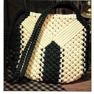 May include: A white and green macrame bag with a long strap. The bag is made with a knotting technique and has a diamond pattern.