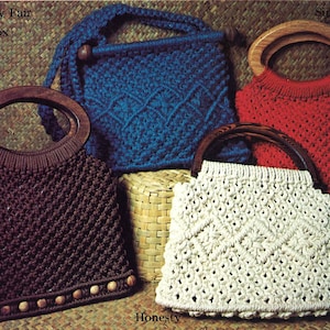 May include: Four crocheted bags with wooden handles. The bags are in different colours: blue, red, brown, and white. The bags are labelled with the words "Country Fair Bandbox", "Simplicity", "Honesty", and "Simplicity".