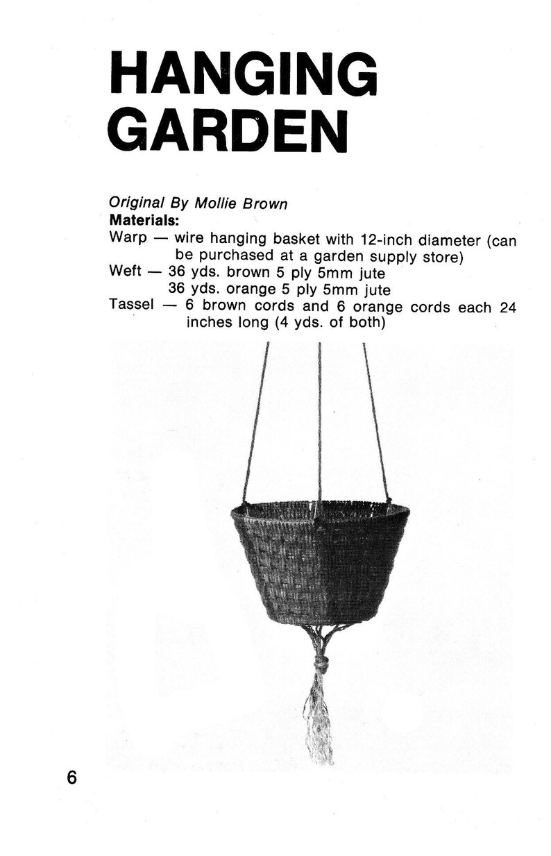 May include: A hanging garden basket made of brown and orange jute with a 12-inch diameter. The basket is suspended by two cords and has a tassel made of brown and orange cords.