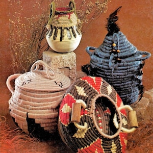 May include: Four woven baskets in different styles and colours. The baskets are made of natural materials and have a variety of patterns and designs.