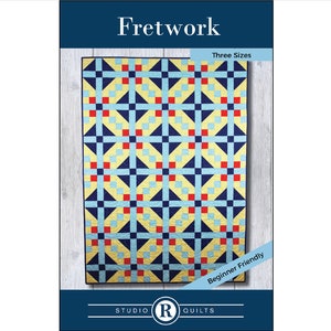 May include: A quilting pattern for a quilt called "Fretwork" with a geometric design in blue, yellow, red, and white. The pattern is available in three sizes and is beginner friendly. The pattern is from Studio R Quilts.