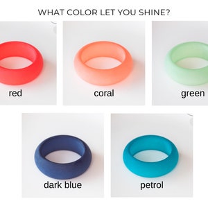 May include: Five silicone rings in different colors: red, coral, green, dark blue, and petrol. The rings are all the same size and shape, and they are arranged in a grid pattern. The text "WHAT COLOR LET YOU SHINE?" is at the top of the image.